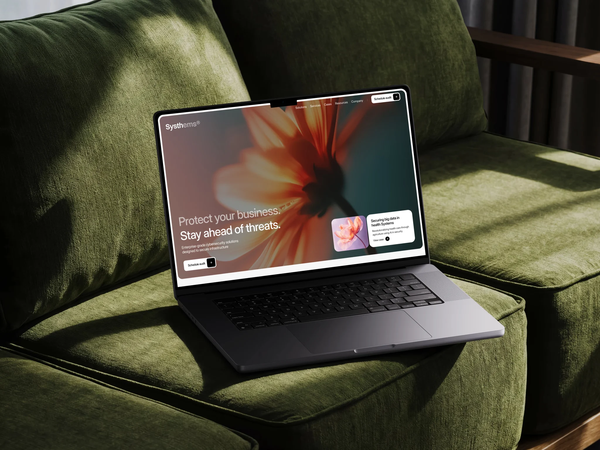 Systhems cybersecurity website concept displayed on a laptop against a deep green background