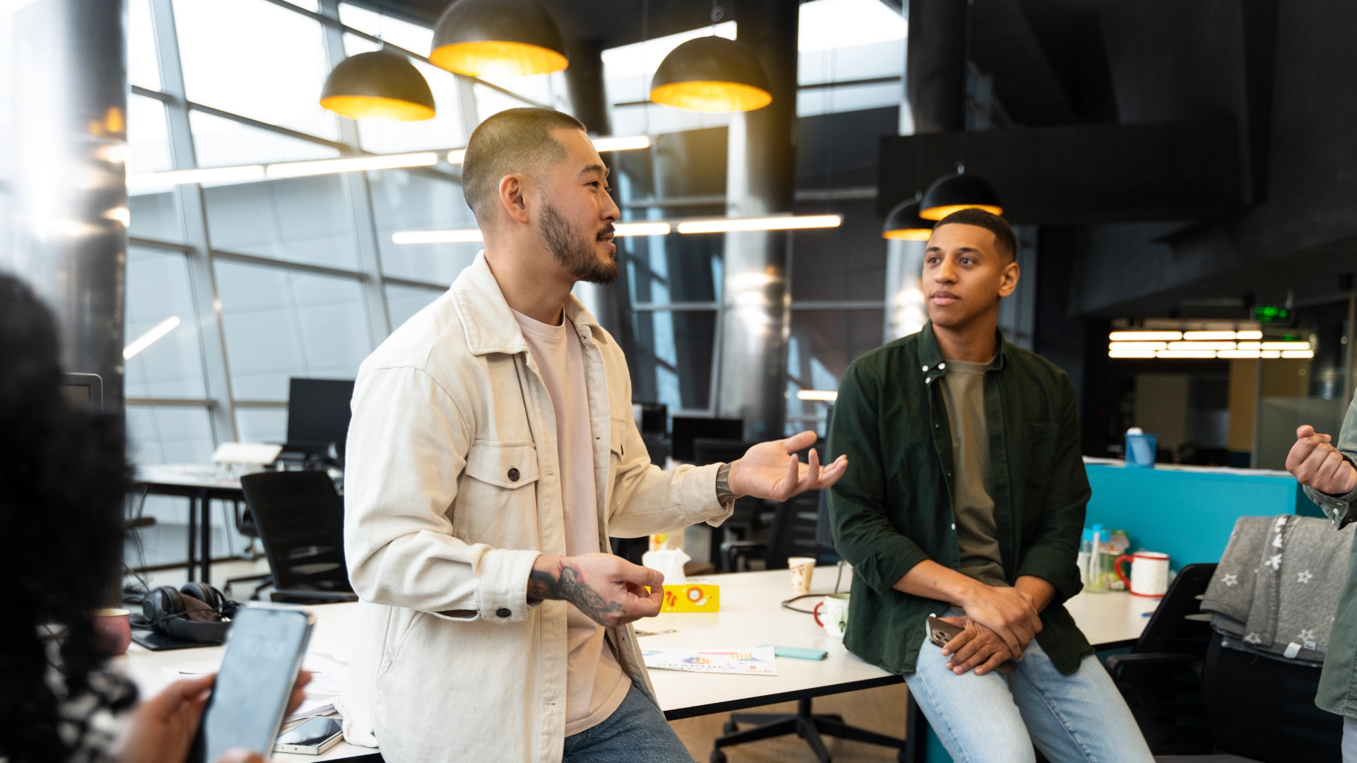 Collaborators reviewing a project together at a workspace
